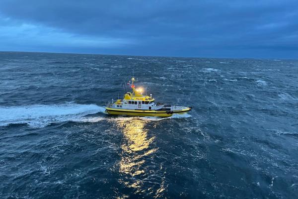 Pilot boat at sea in dark light
