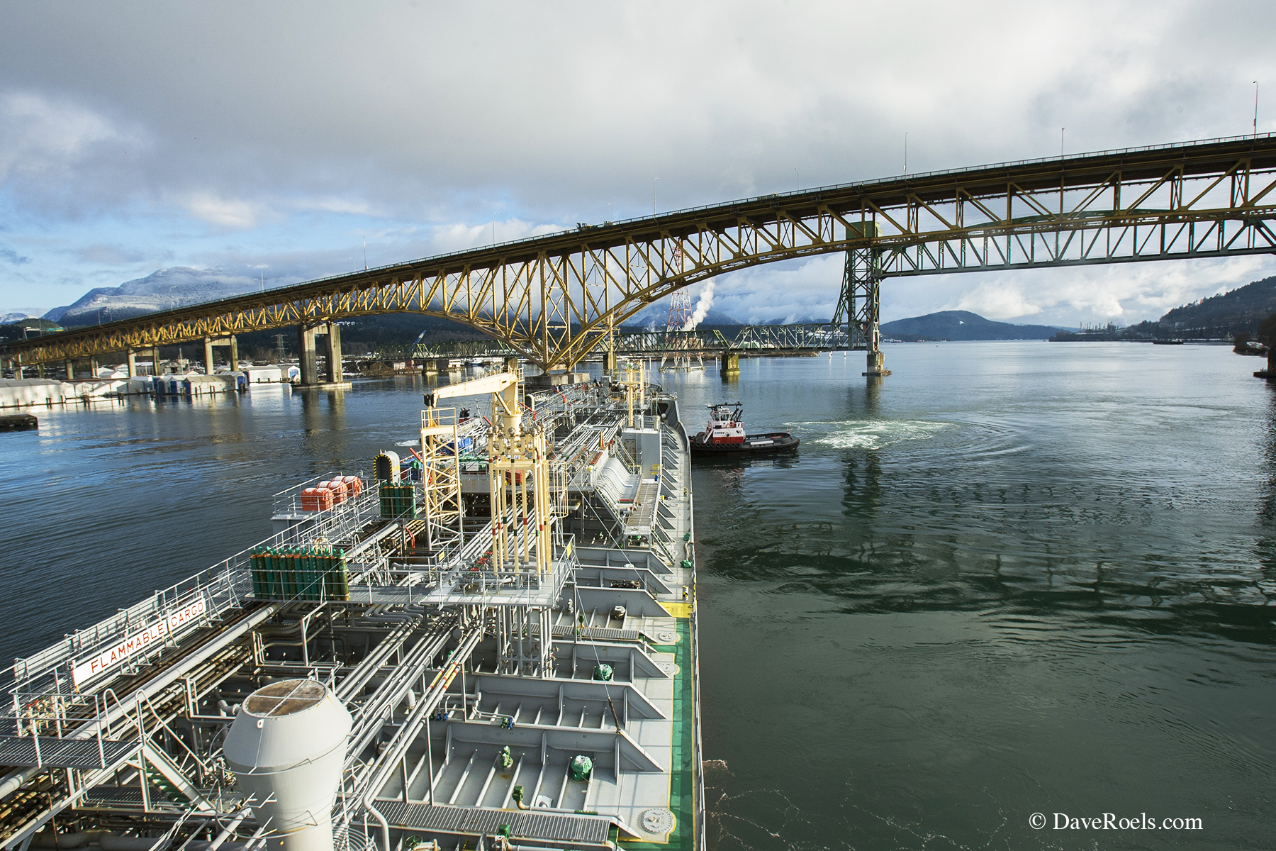 ship passing under bridge