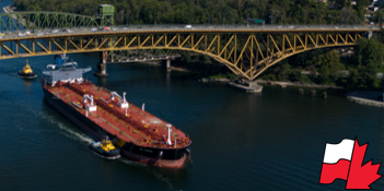 tanker accompanied by tug boats