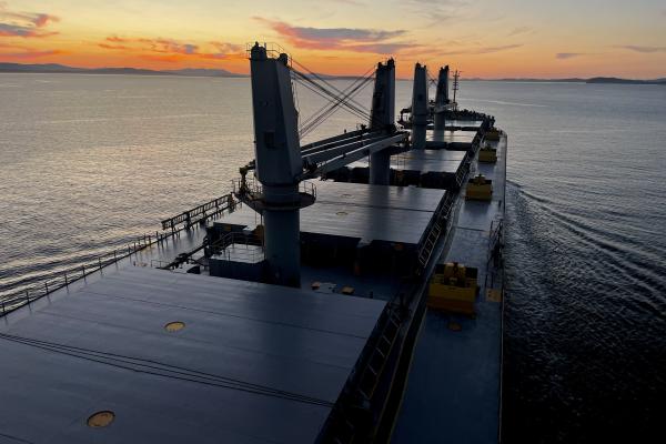 Ship moving at sunset