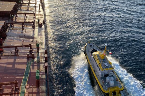Pilot boat approaching a ship